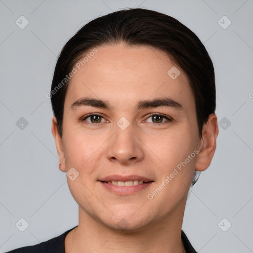 Joyful white young-adult male with short  black hair and brown eyes