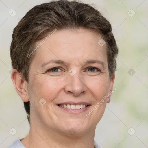 Joyful white adult female with short  brown hair and grey eyes