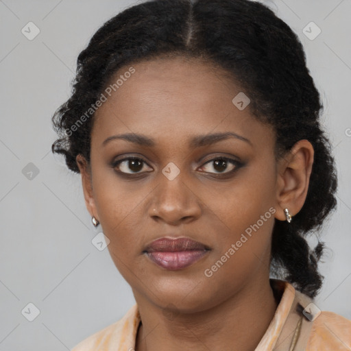 Joyful black young-adult female with medium  black hair and brown eyes