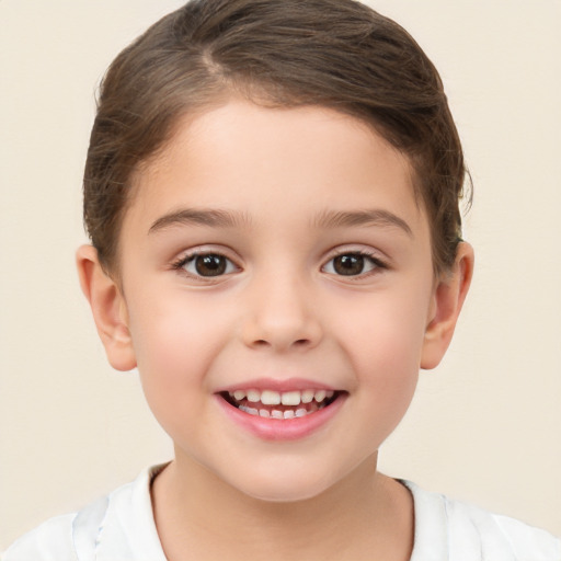 Joyful white child female with short  brown hair and brown eyes