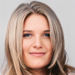 Joyful white young-adult female with long  brown hair and blue eyes