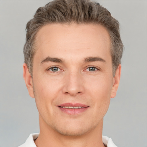 Joyful white adult male with short  brown hair and brown eyes