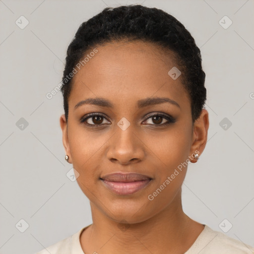 Joyful black young-adult female with short  black hair and brown eyes