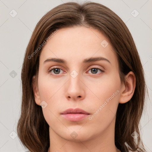 Neutral white young-adult female with long  brown hair and brown eyes