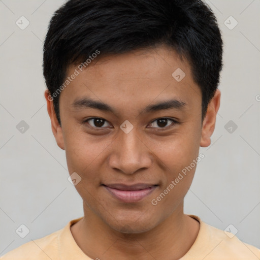 Joyful asian young-adult male with short  black hair and brown eyes