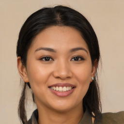 Joyful asian young-adult female with long  brown hair and brown eyes