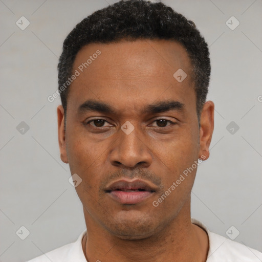 Neutral latino young-adult male with short  black hair and brown eyes