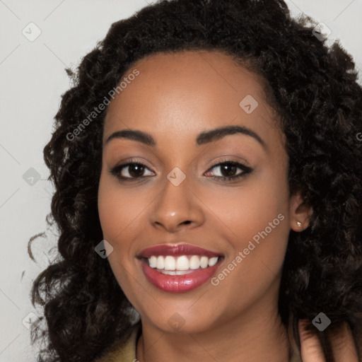 Joyful latino young-adult female with long  black hair and brown eyes