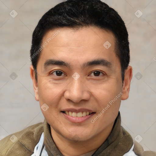 Joyful white adult male with short  brown hair and brown eyes