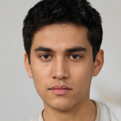 Neutral latino young-adult male with short  black hair and brown eyes