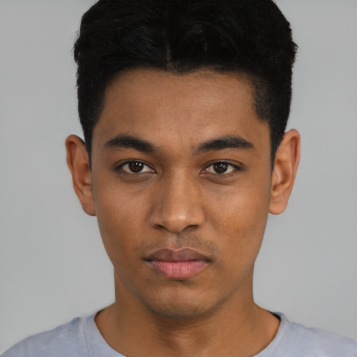 Neutral latino young-adult male with short  black hair and brown eyes