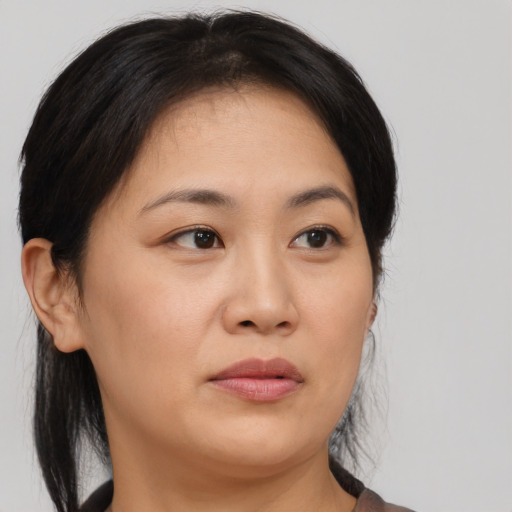 Neutral asian young-adult female with medium  brown hair and brown eyes