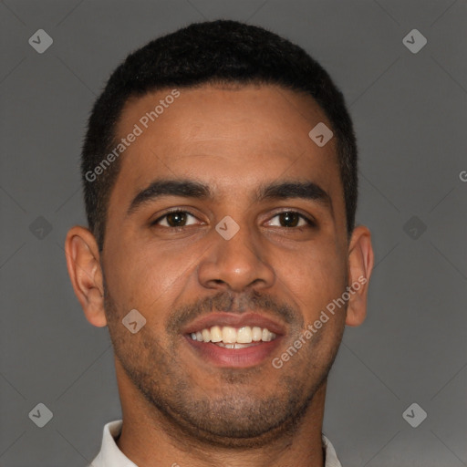 Joyful black young-adult male with short  brown hair and brown eyes