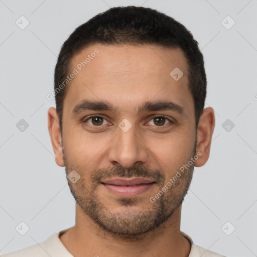 Joyful white young-adult male with short  black hair and brown eyes