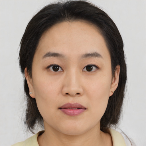 Neutral asian young-adult female with medium  black hair and brown eyes