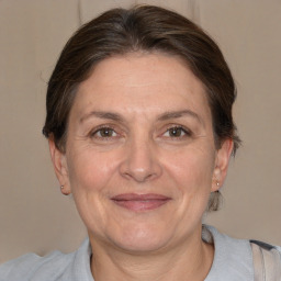 Joyful white adult female with short  brown hair and brown eyes