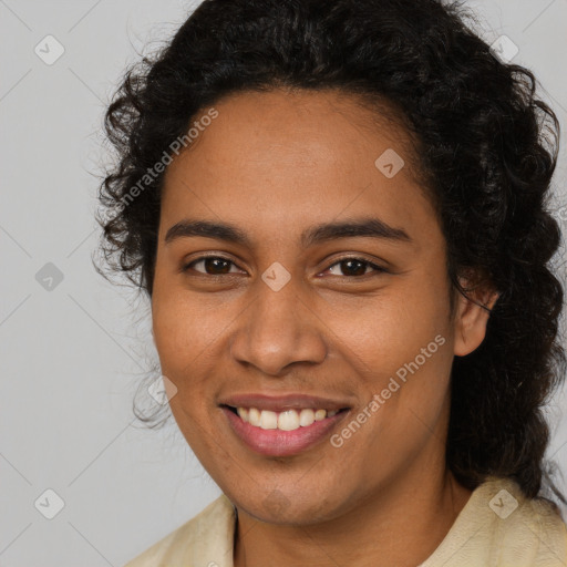 Joyful latino young-adult female with medium  brown hair and brown eyes