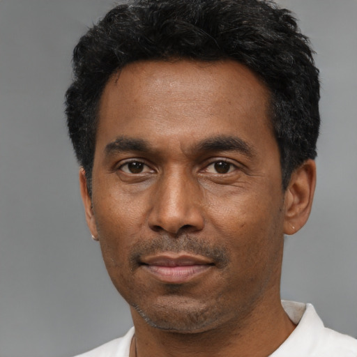 Neutral black adult male with short  black hair and brown eyes