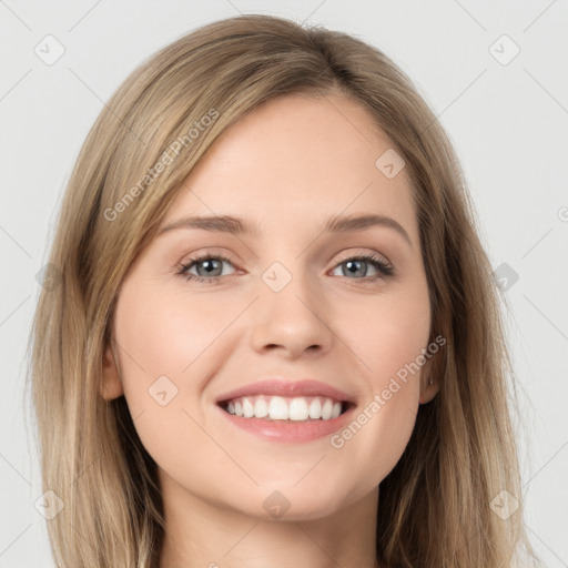 Joyful white young-adult female with long  brown hair and grey eyes