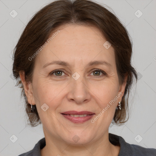 Joyful white adult female with medium  brown hair and brown eyes