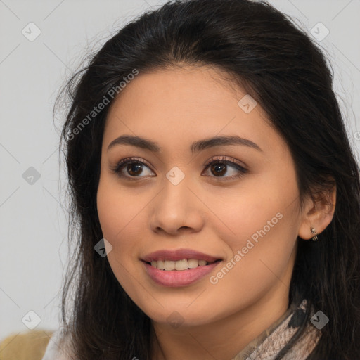 Joyful latino young-adult female with long  brown hair and brown eyes