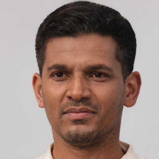Neutral latino young-adult male with short  black hair and brown eyes