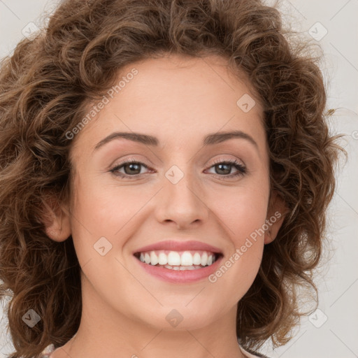 Joyful white young-adult female with long  brown hair and green eyes