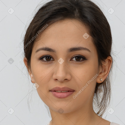 Joyful latino young-adult female with medium  brown hair and brown eyes