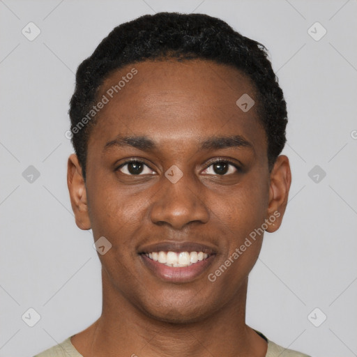 Joyful black young-adult male with short  black hair and brown eyes