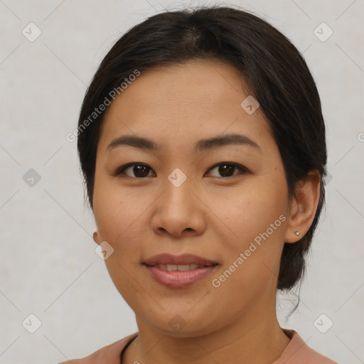 Joyful asian young-adult female with short  brown hair and brown eyes