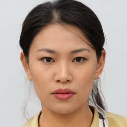 Neutral asian young-adult female with medium  brown hair and brown eyes