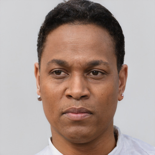 Neutral latino adult male with short  black hair and brown eyes