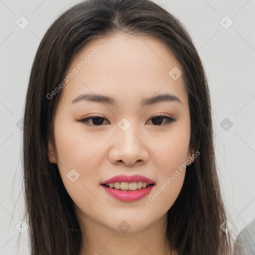 Joyful asian young-adult female with long  brown hair and brown eyes