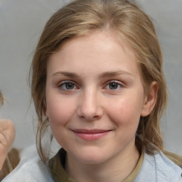 Joyful white child female with medium  brown hair and brown eyes