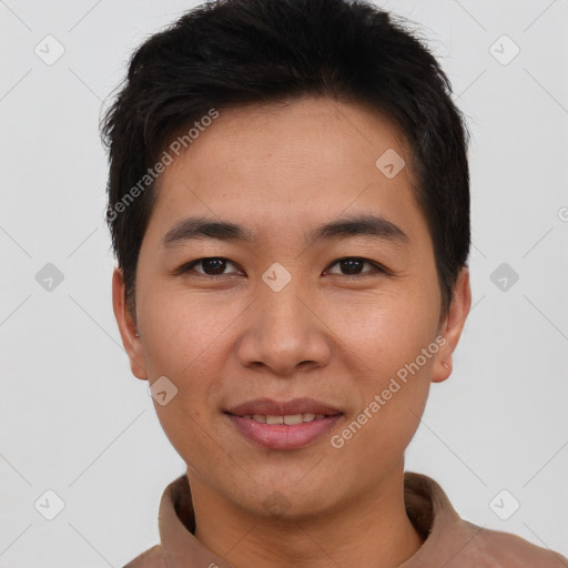 Joyful asian young-adult male with short  brown hair and brown eyes