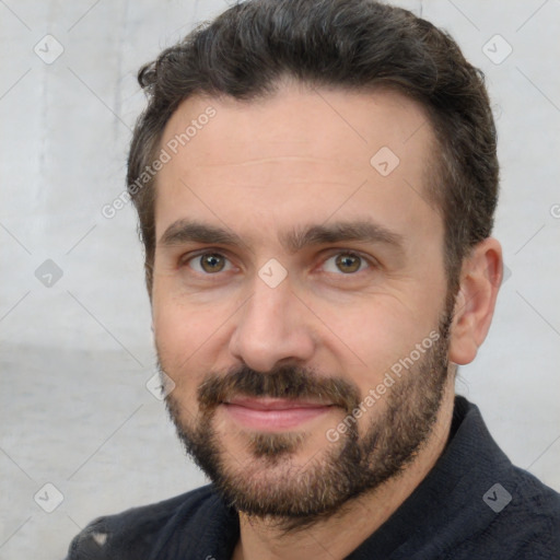 Joyful white young-adult male with short  black hair and brown eyes