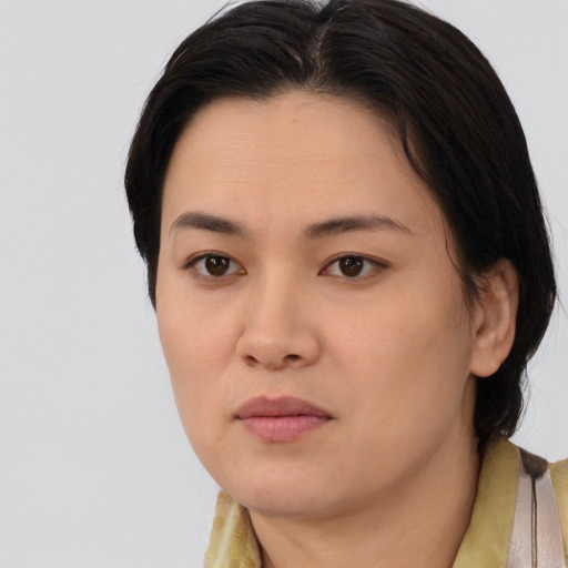 Neutral asian young-adult female with medium  brown hair and brown eyes