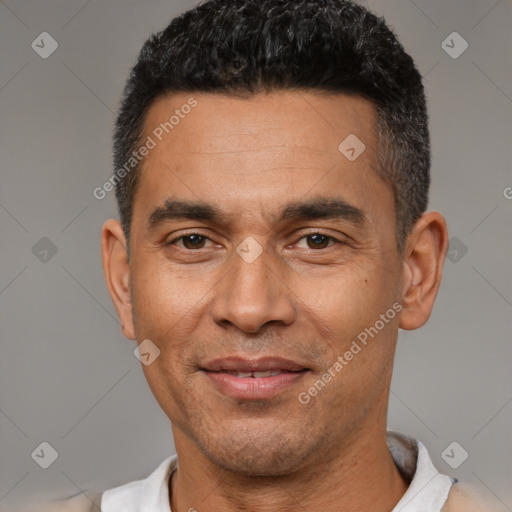 Joyful latino adult male with short  black hair and brown eyes