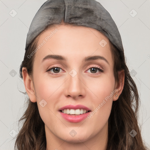 Joyful white young-adult female with long  brown hair and grey eyes