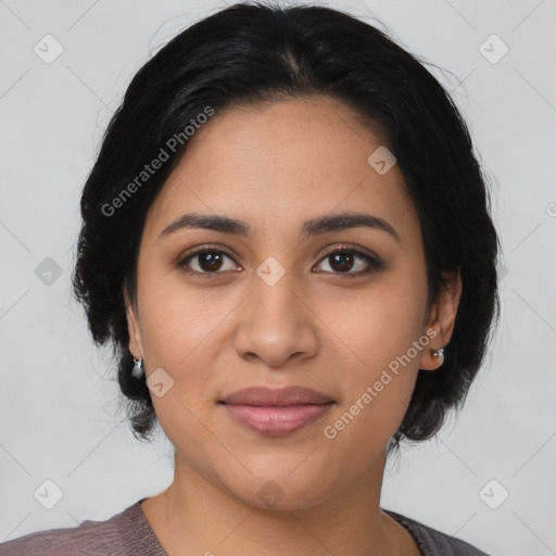 Joyful latino young-adult female with medium  black hair and brown eyes