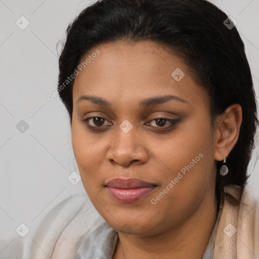 Joyful black young-adult female with long  brown hair and brown eyes