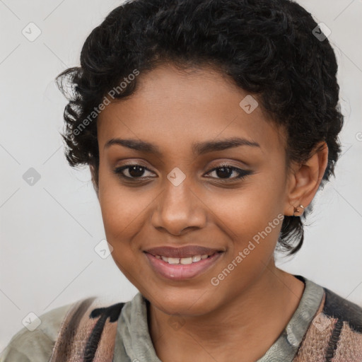 Joyful black young-adult female with short  black hair and brown eyes