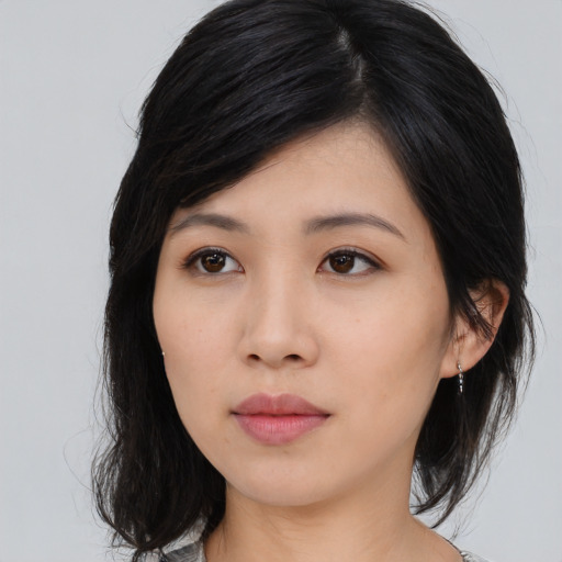 Neutral asian young-adult female with medium  black hair and brown eyes