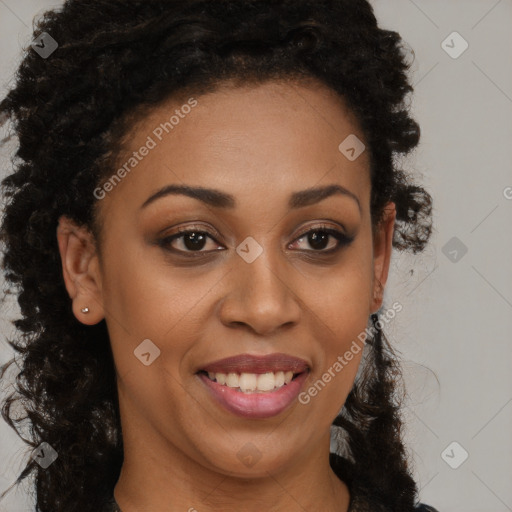 Joyful black young-adult female with long  brown hair and brown eyes