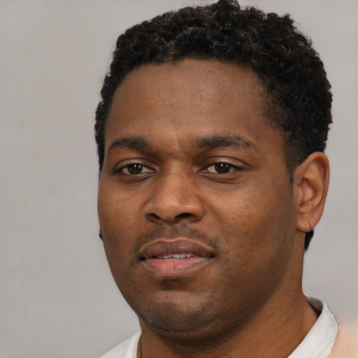 Neutral black young-adult male with short  black hair and brown eyes