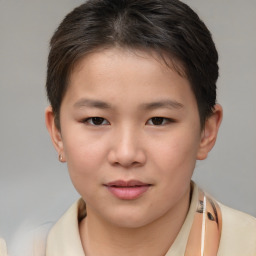 Joyful white child female with short  brown hair and brown eyes