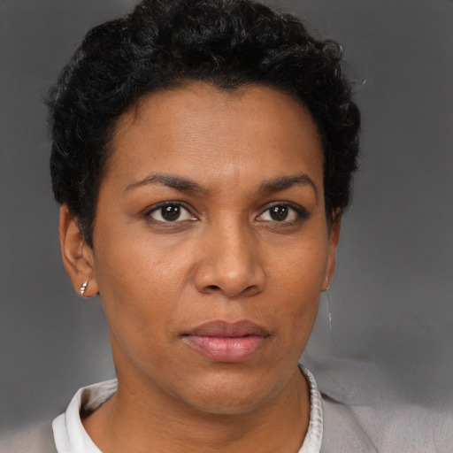 Neutral black young-adult female with short  brown hair and brown eyes
