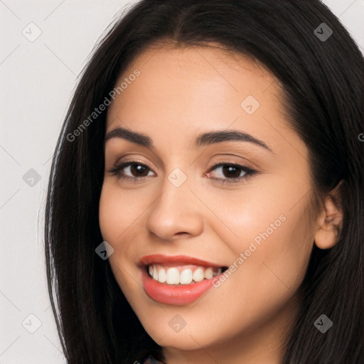 Joyful latino young-adult female with long  brown hair and brown eyes