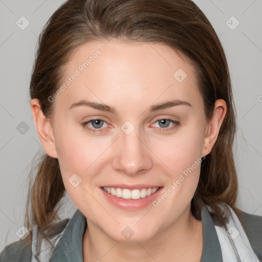 Joyful white young-adult female with medium  brown hair and blue eyes