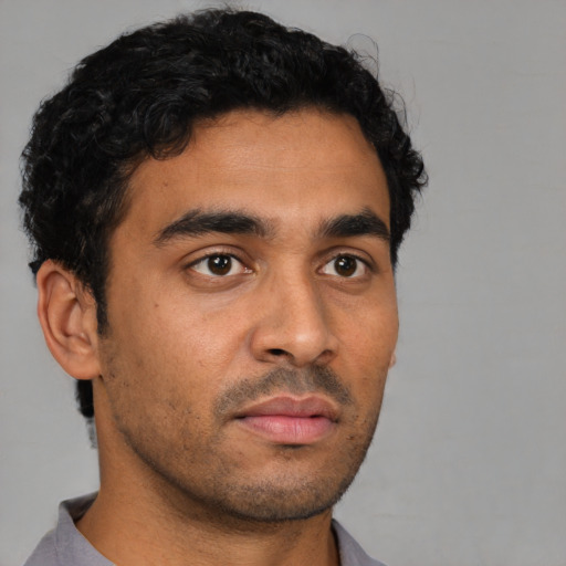 Neutral latino young-adult male with short  black hair and brown eyes